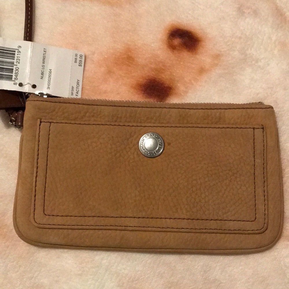 Tan Suede Coach wristlet.